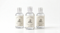 Three small bottles of 'Doctor Shoe' with labels on a white background