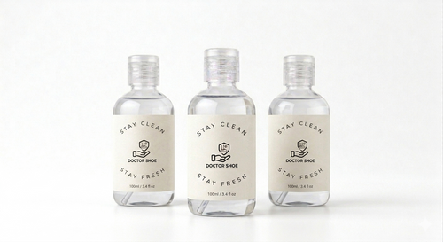 Three small bottles of 'Doctor Shoe' with labels on a white background